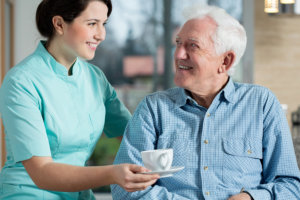 caregiver assisting senior man